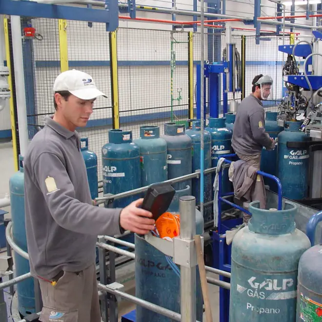 A facility manager pressing the control panel