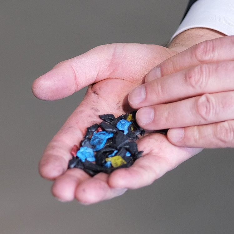 image of Hand With Plastic Granulate