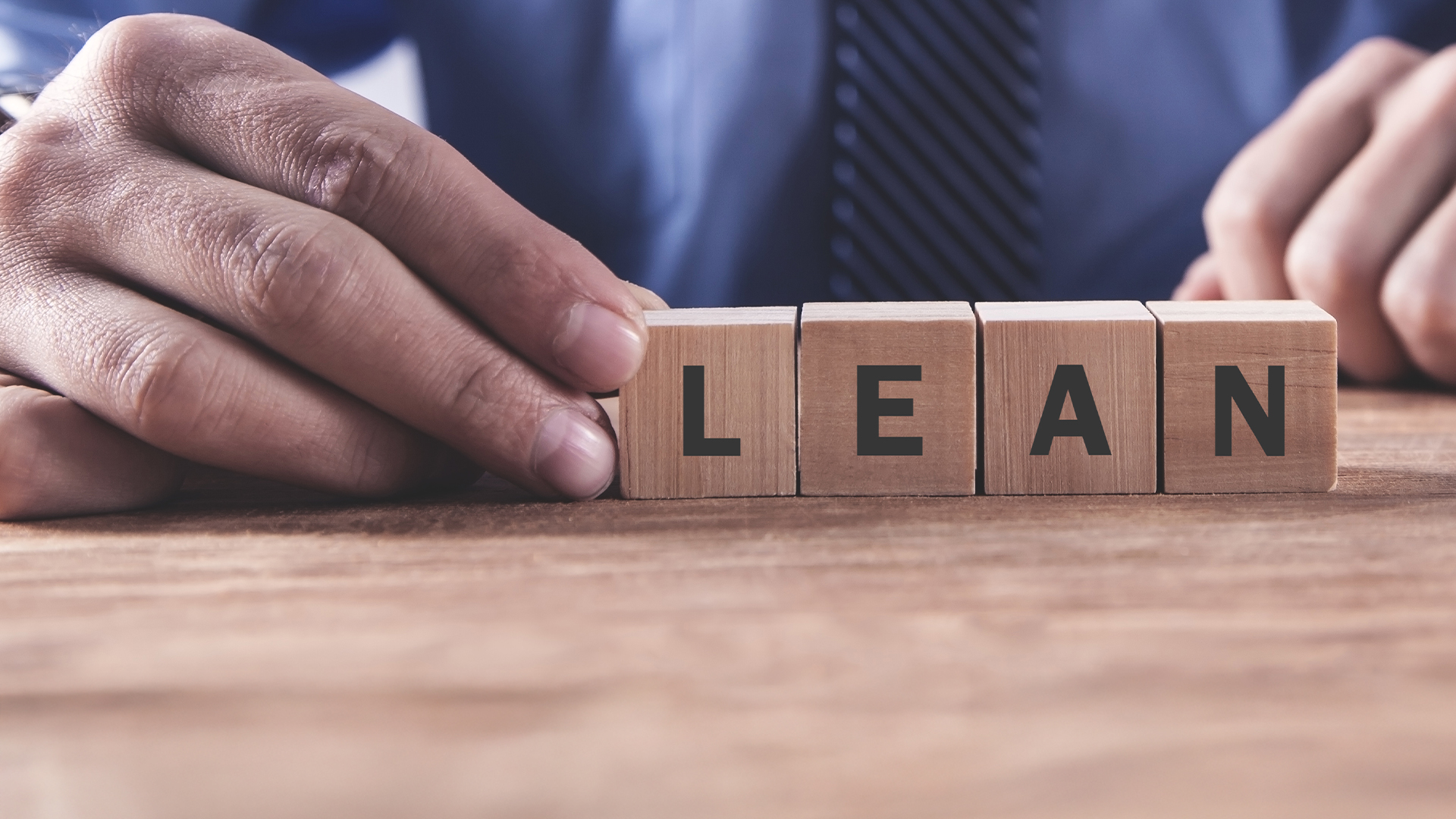 wooden blocks on a table forming in the word LEAN