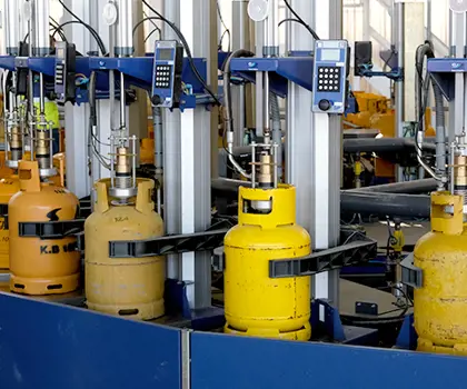 Yellow gas cylinders on a filling carrousel
