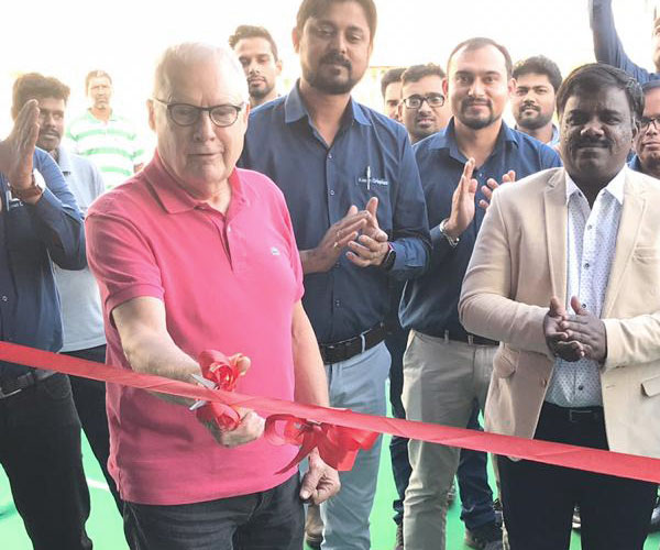 A red ribbon being cut at the inauguration ceremony of our new training centre