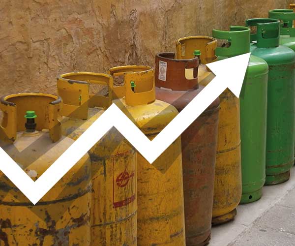 Upward pointing graph over a picture of worn LPG cylinders