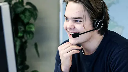 image of a smiling man with headset