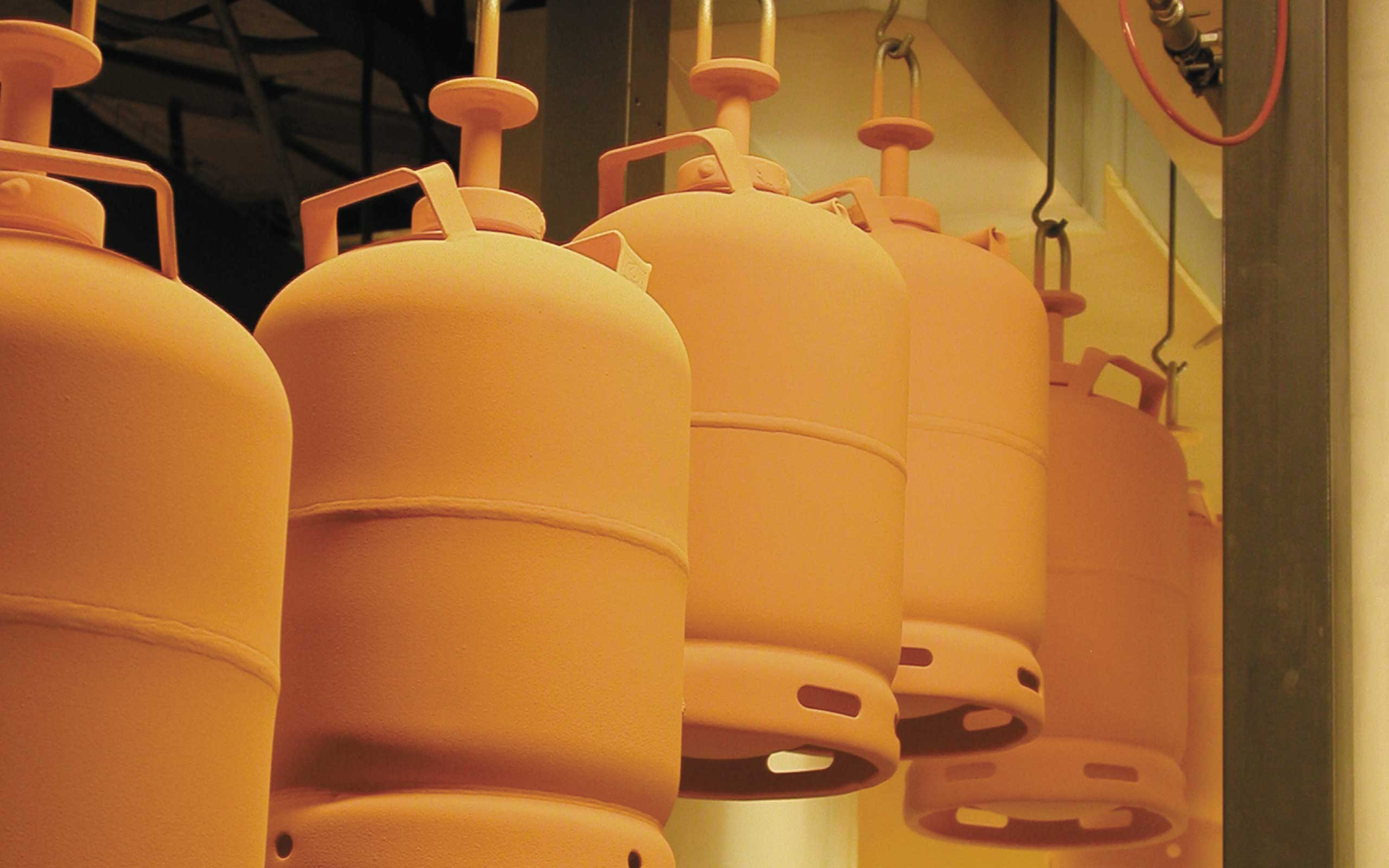 LPG cylinders exiting a painting tunnel