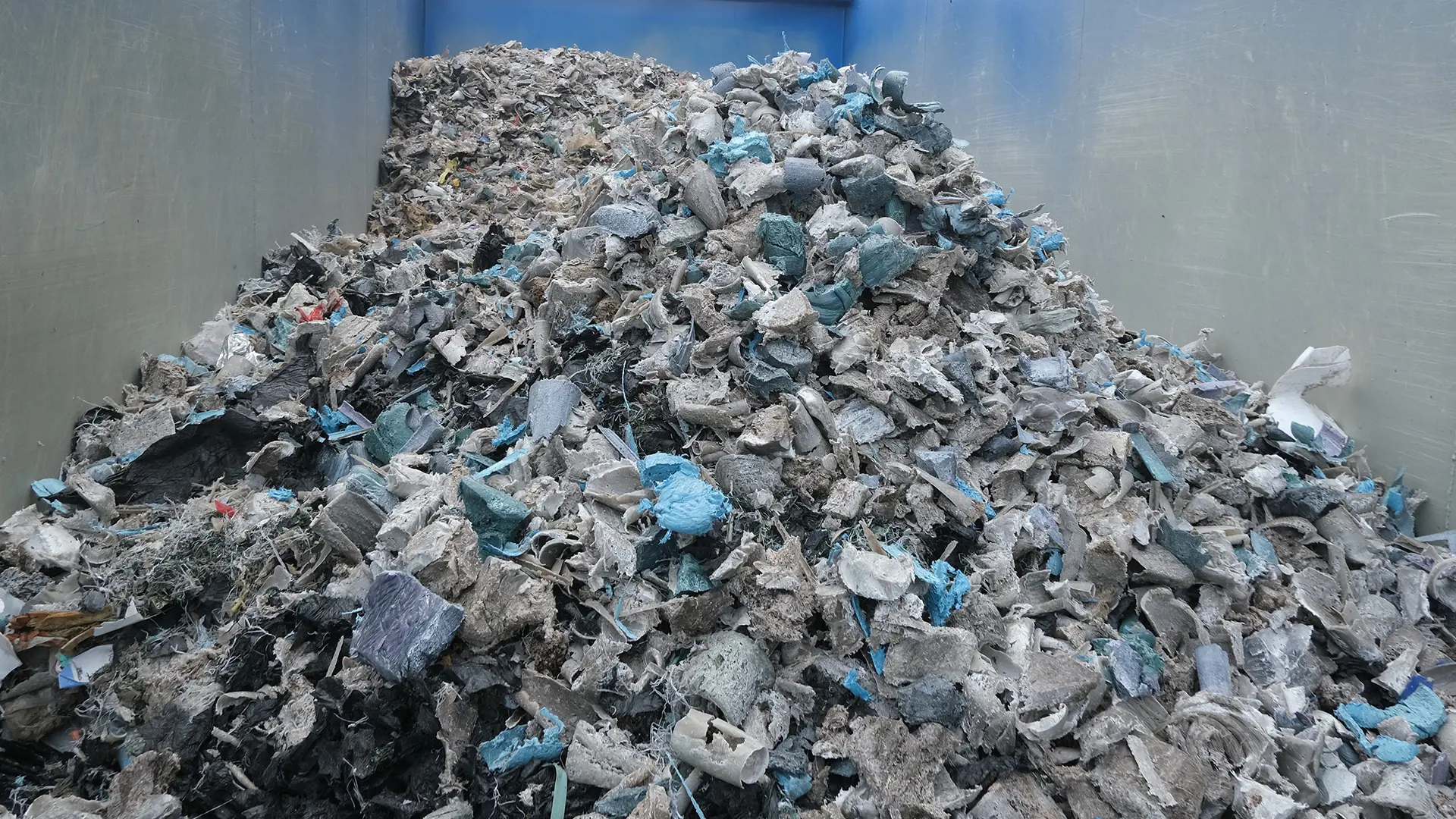 image of densified plastic pieces in a container