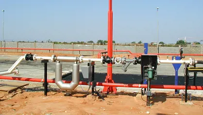image of a fire water system with red pipelines and an white LPG tank