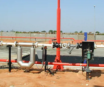 image of a fire water system with red pipelines and an white LPG tank