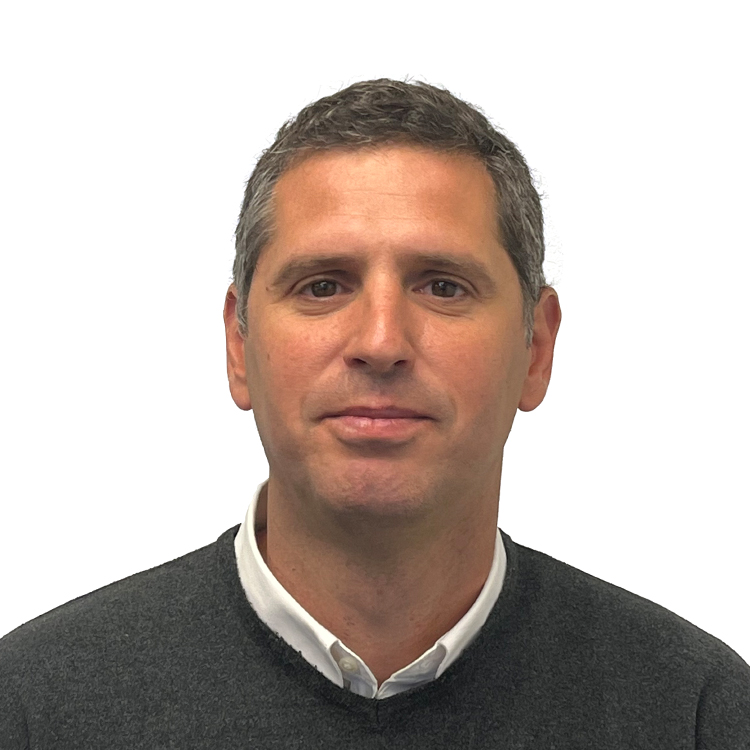 image of a middle-aged guy with dark grayed hair white shirt and dark gray pullover