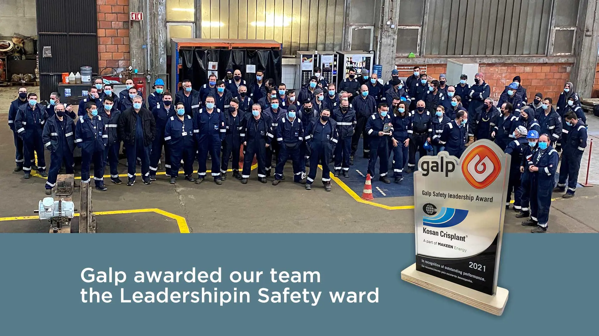 Group image of a gathered MAKEEN Energy team and an adward