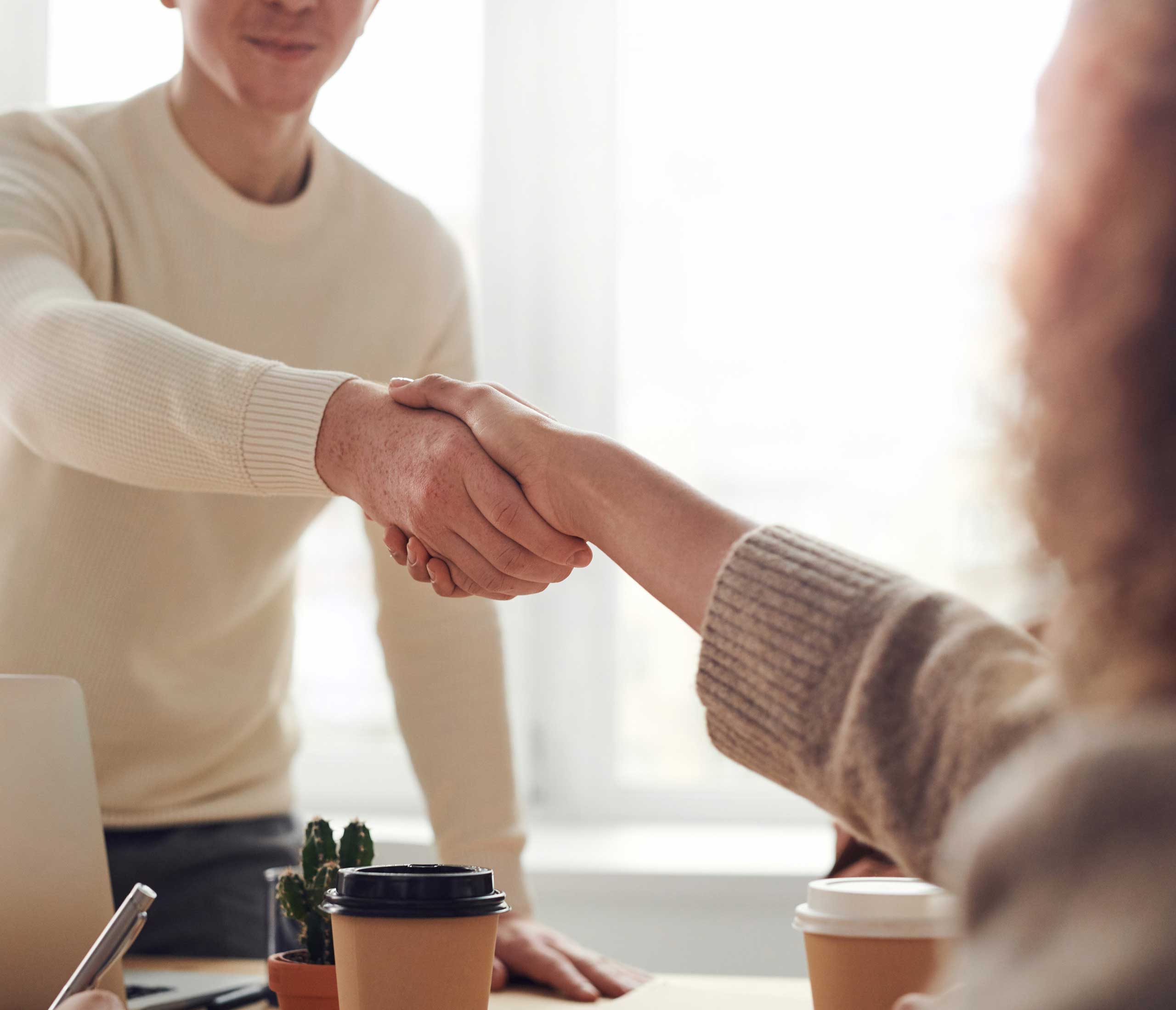 Handshake over a table