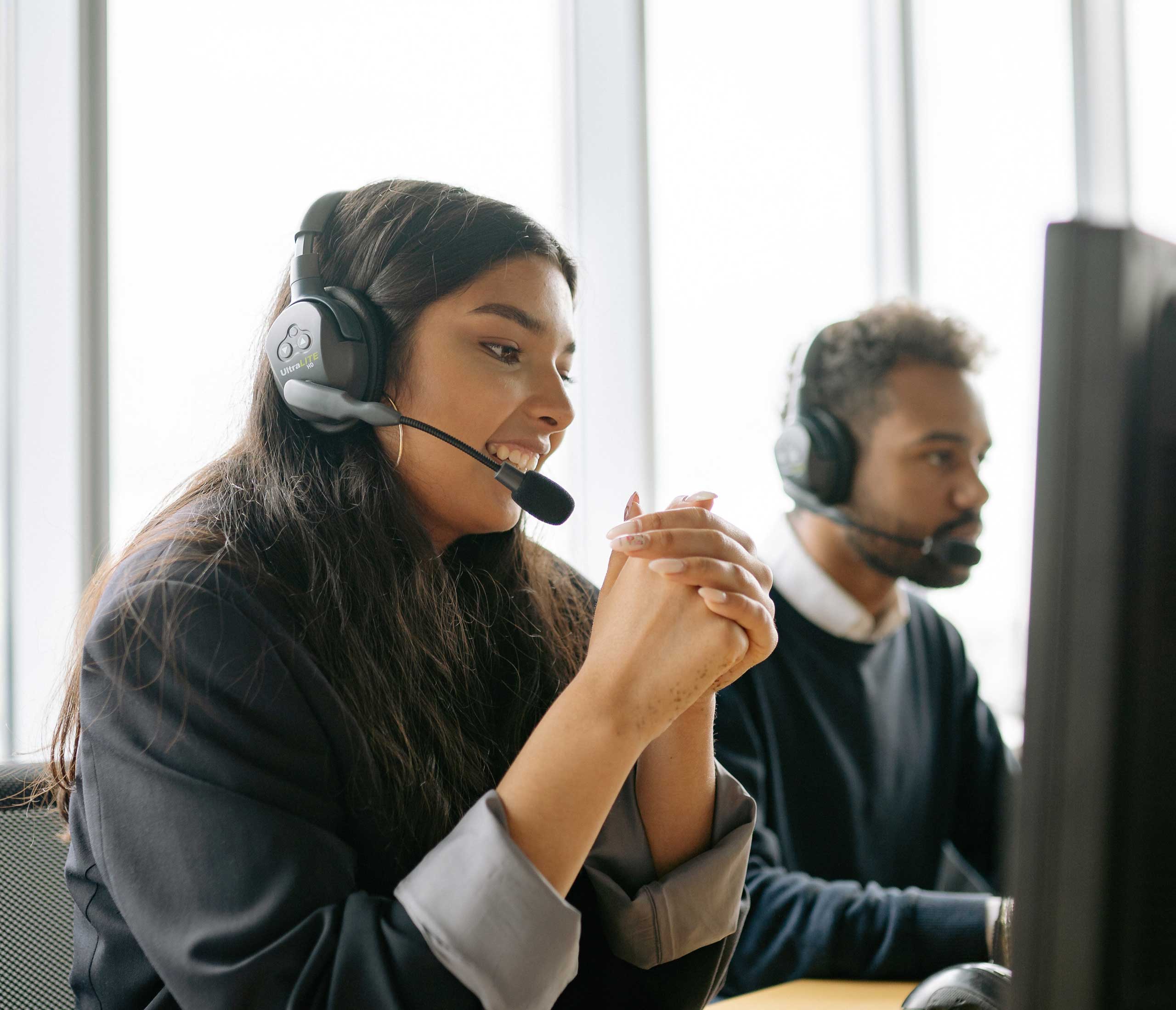 image of a woman talking in headset