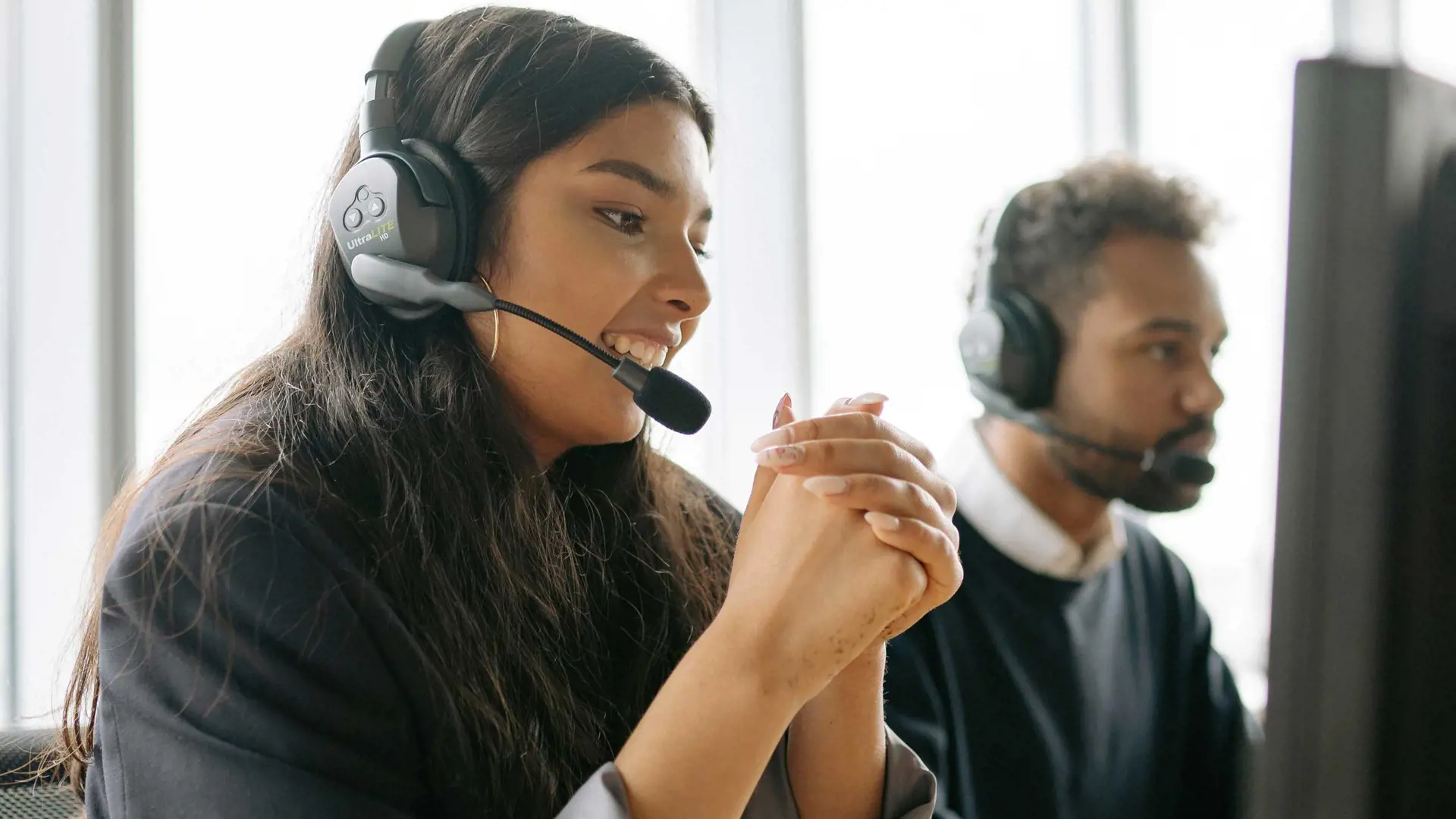 image of a woman talking in headset